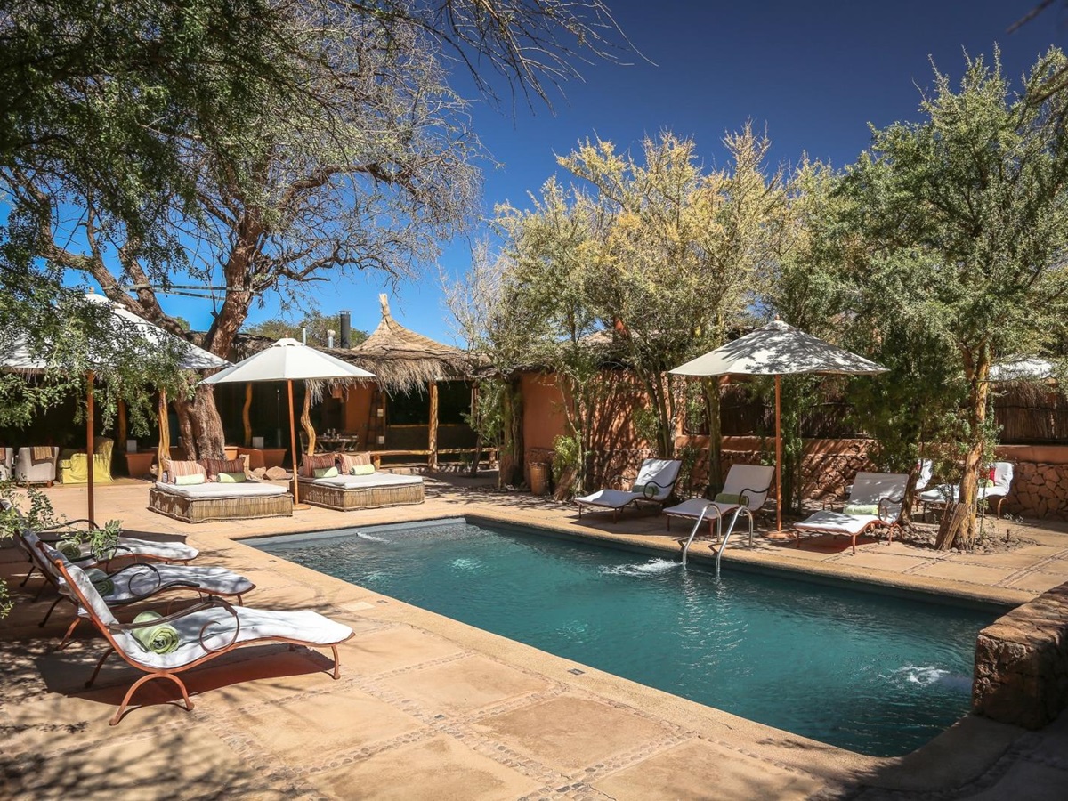 Pool and loungers at Awasi Atacama