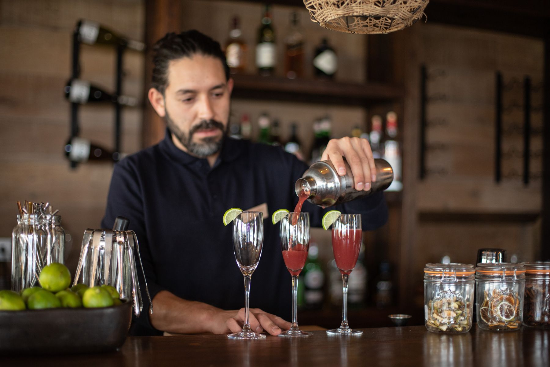 Barman preparing cocktails at Estancia Cerro Guido in Patagonia Chile