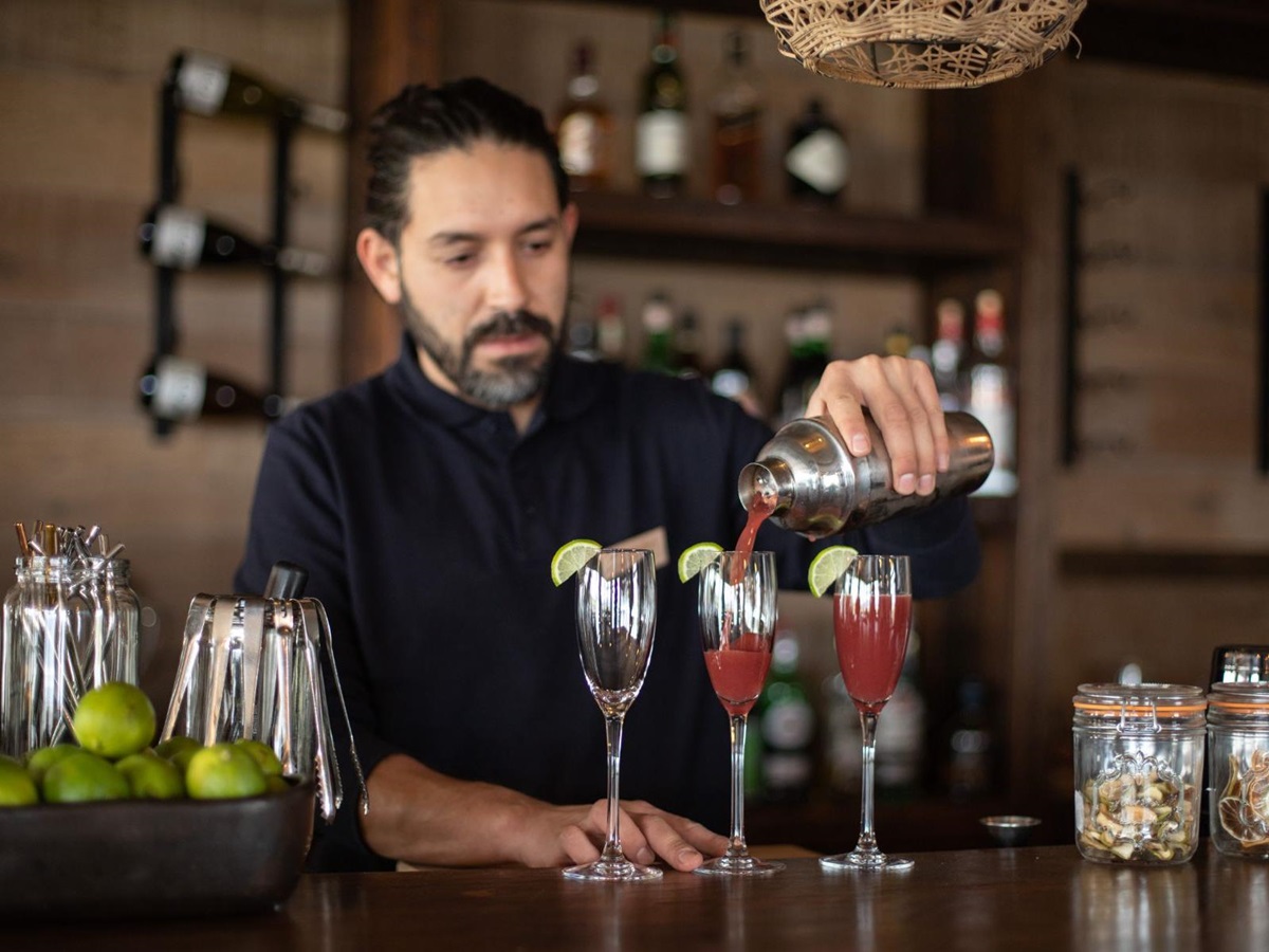 Barman preparing cocktails at Estancia Cerro Guido in Patagonia Chile