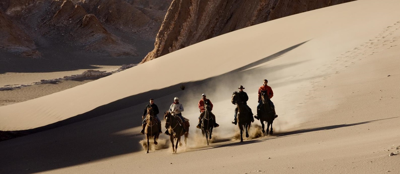 Five riders in the Atacama Desert