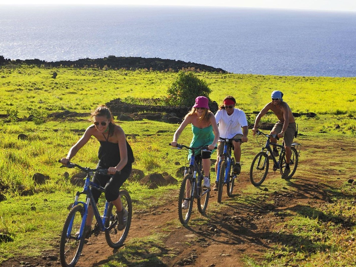 Group of people cycling on Easter Island from Explora Rapa Nui