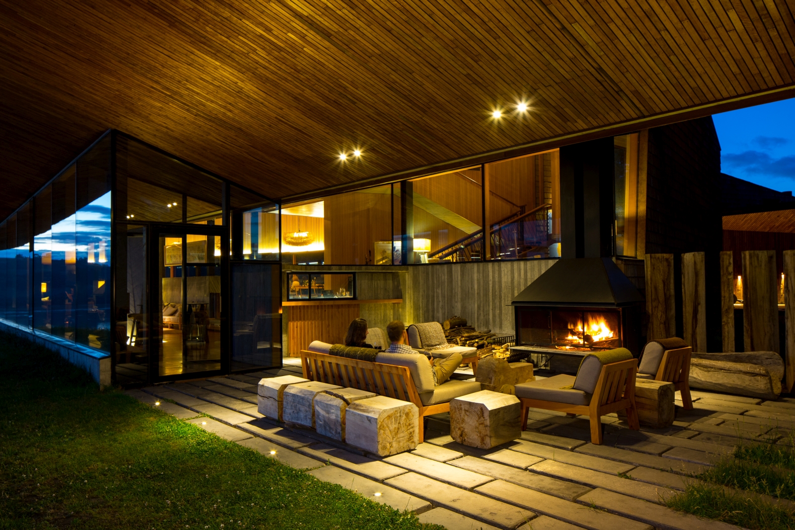 Outdoor lounge at Tierra Chiloe with fireplace