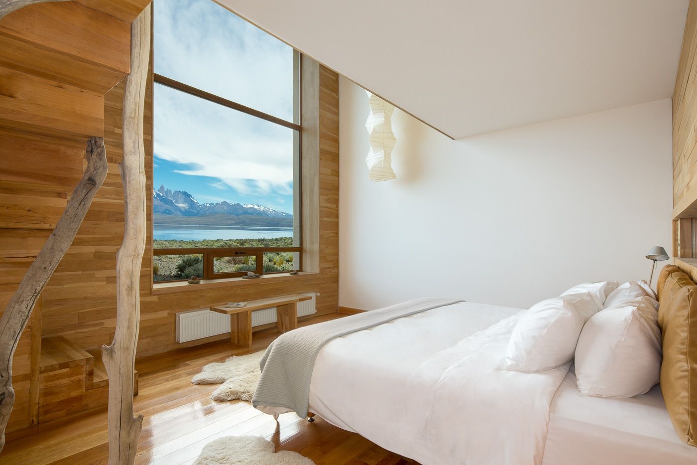 Stylish, light bedroom with view over the mountains at Tierra Patagonia, Chile