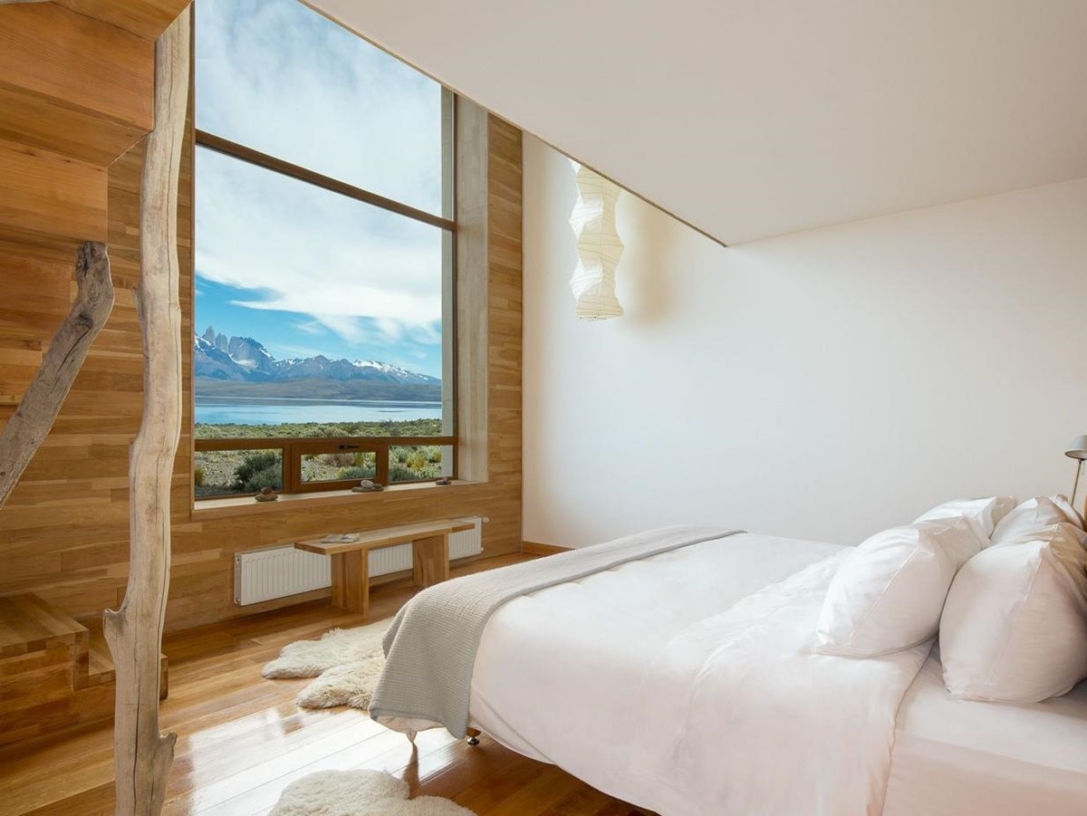 Stylish, light bedroom with view over the mountains at Tierra Patagonia, Chile
