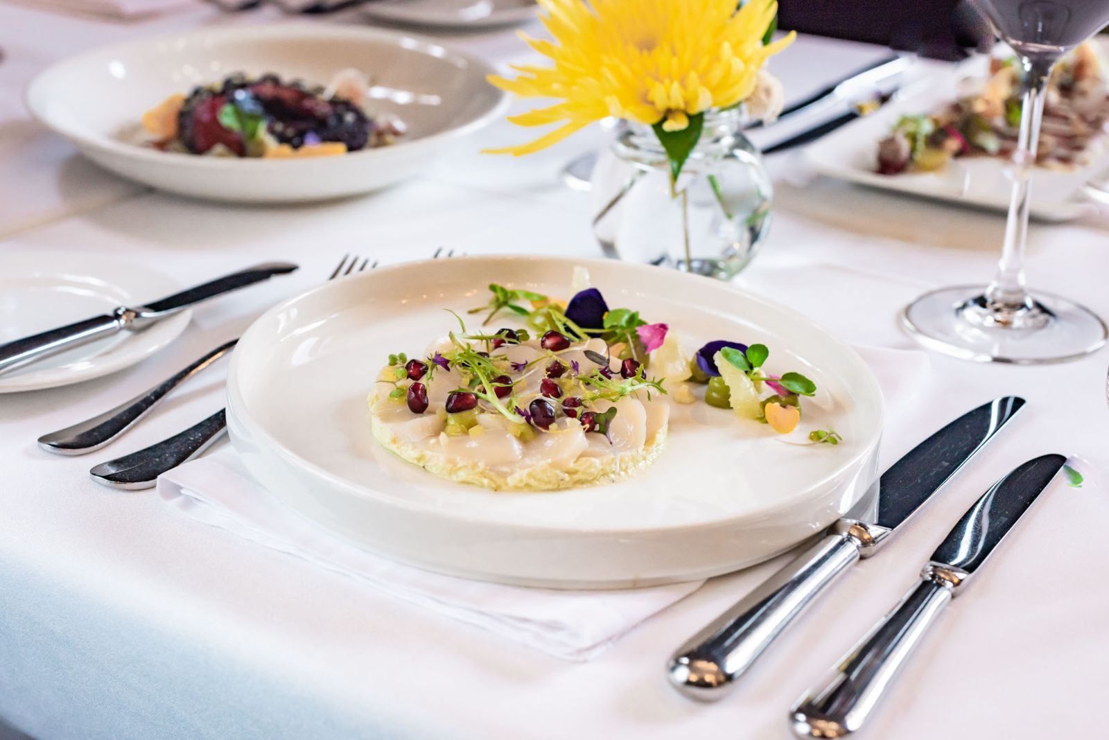 Oyster carpaccio in bright white restaurant at The Singular Santiago Hotel, Chile 