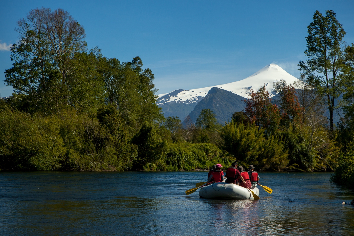 people in a raft on the river