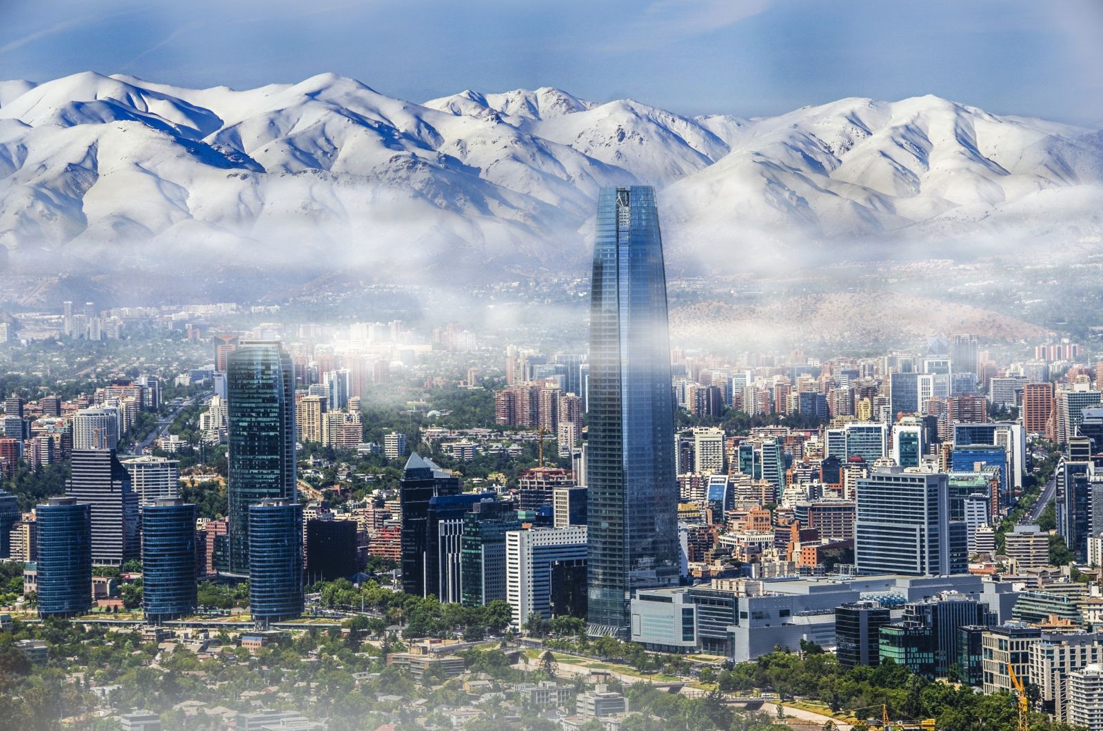 The skyline of Santiago de Chile with snow-capped mountains in the background