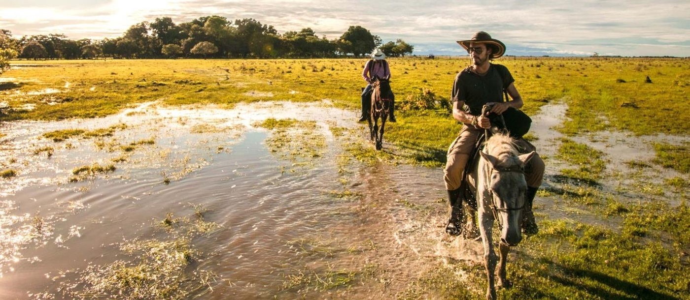 Two people riding at Corocora Camp in Colombia