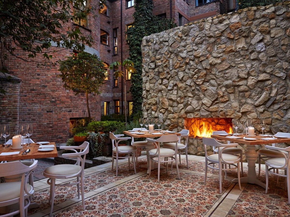 Alfresco dining terrace and fireplace at Four Seasons casa Medina in Bogota, Colombia
