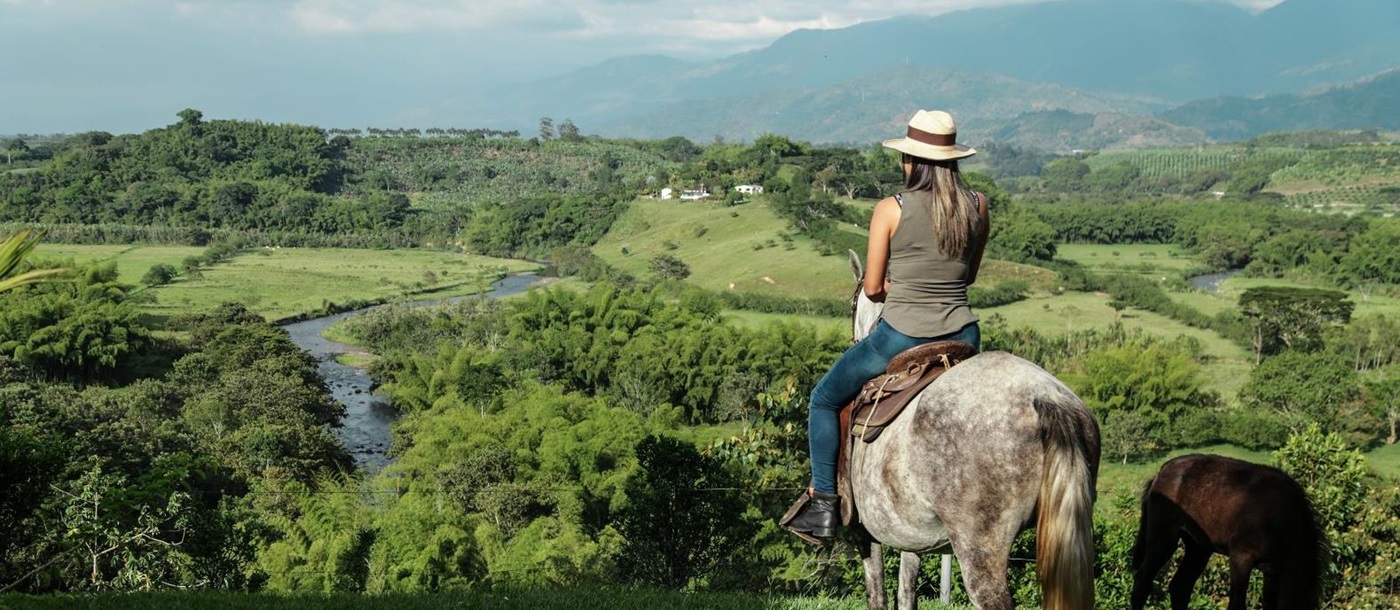 Riding on the grounds of Hacienda Bambusa in Colombia's coffee region
