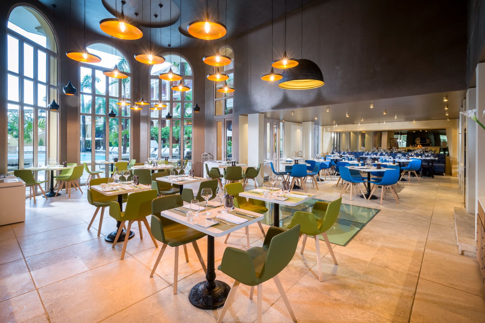 Green restaurant seating area at Sofitel Legend Santa Clara in Cartagena, Colombia