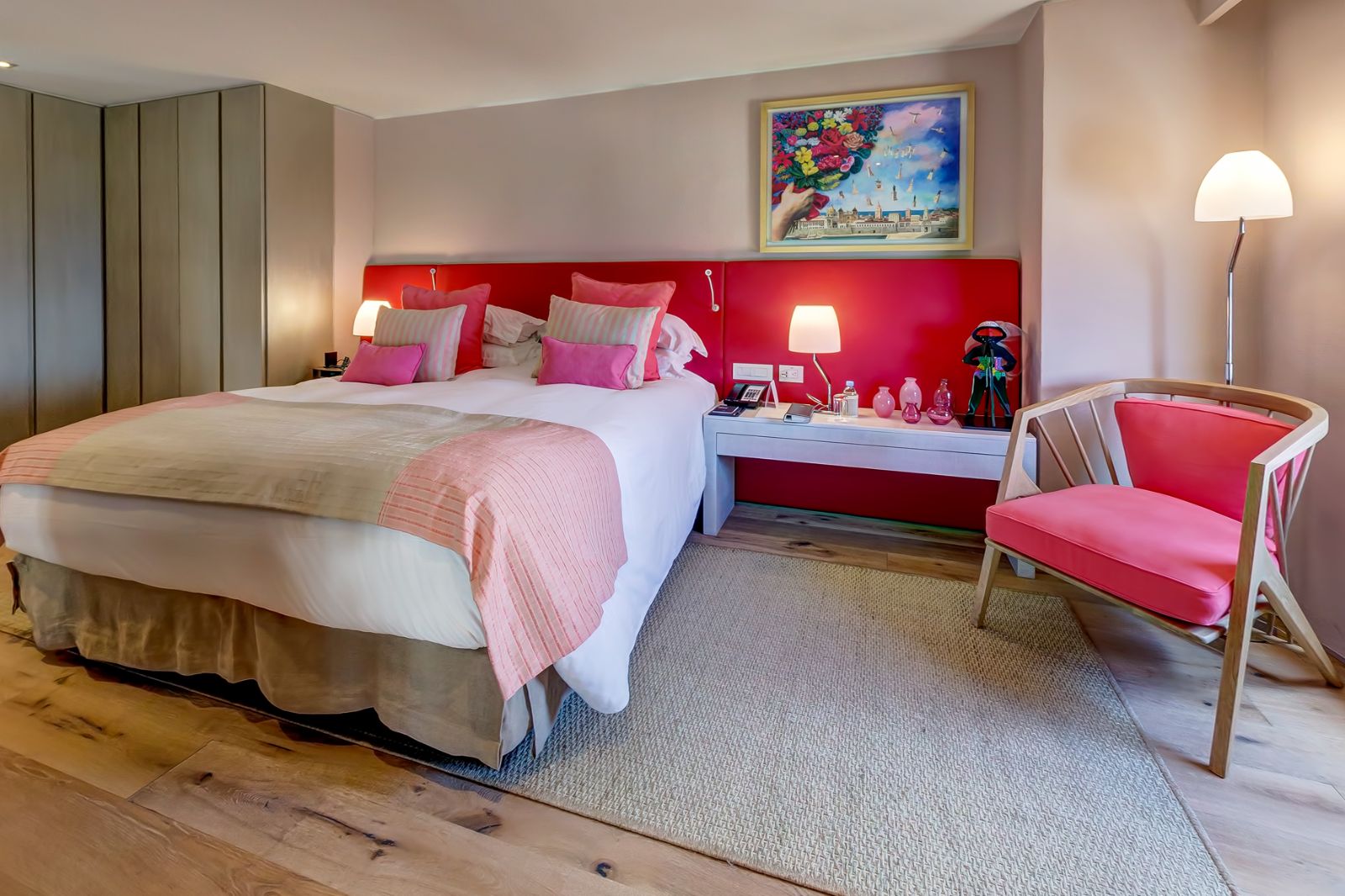 Red guest suite bedroom at Sofitel Legend Santa Clara in Cartagena, Colombia