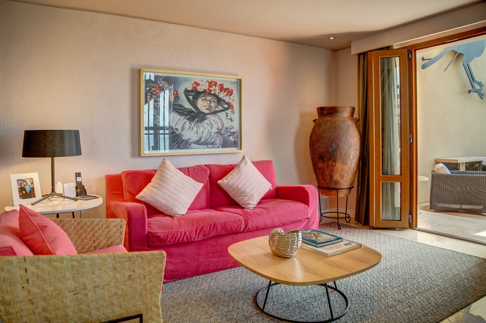Red guest suite living area at Sofitel Legend Santa Clara in Cartagena, Colombia