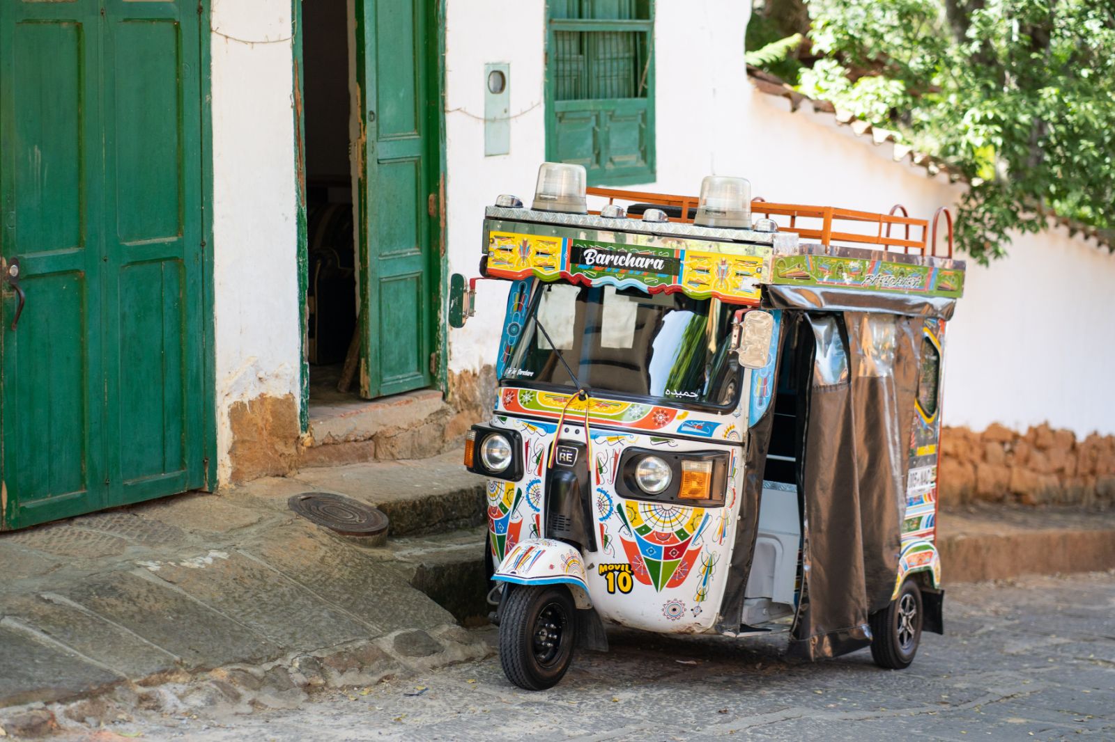 Colourful patterned three-wheeler vehicle in Barichara, Colombia 