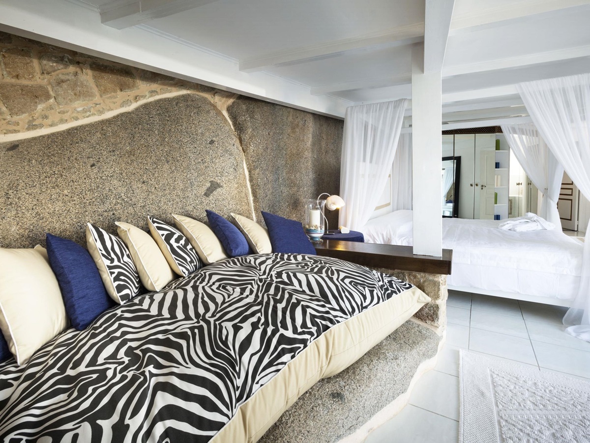 striped furnishings in a bedroom at Hotel & Spa des Pecheurs, Corsica, France