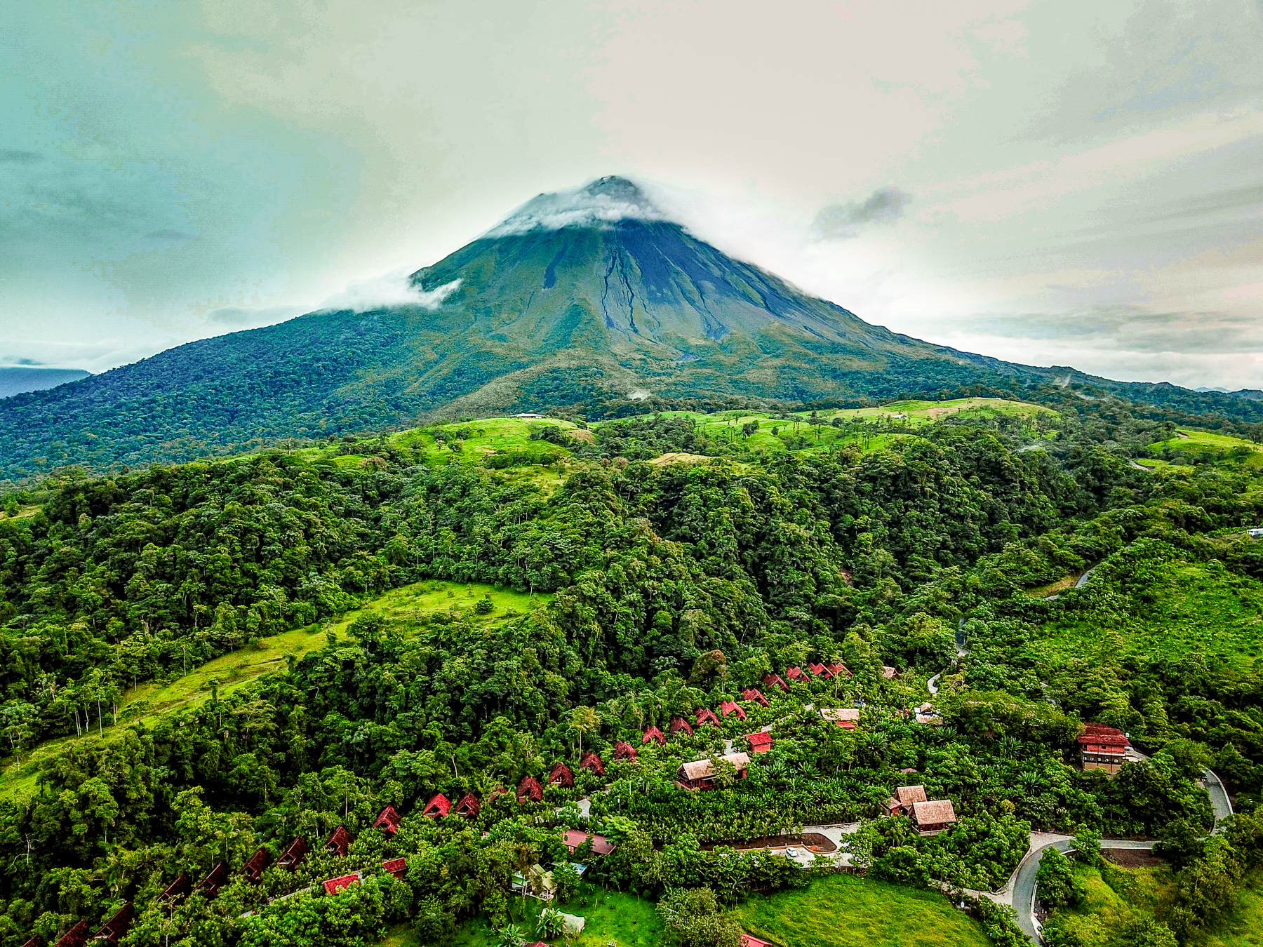 Aerial view of Amor Arenal against a volcano backdrop
