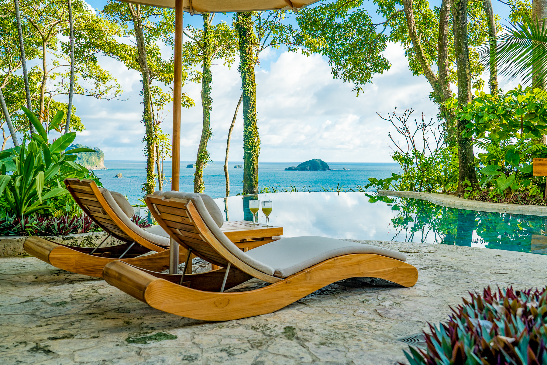Sunbeds by the swimming pool at Arenas del Mar in Costa Rica