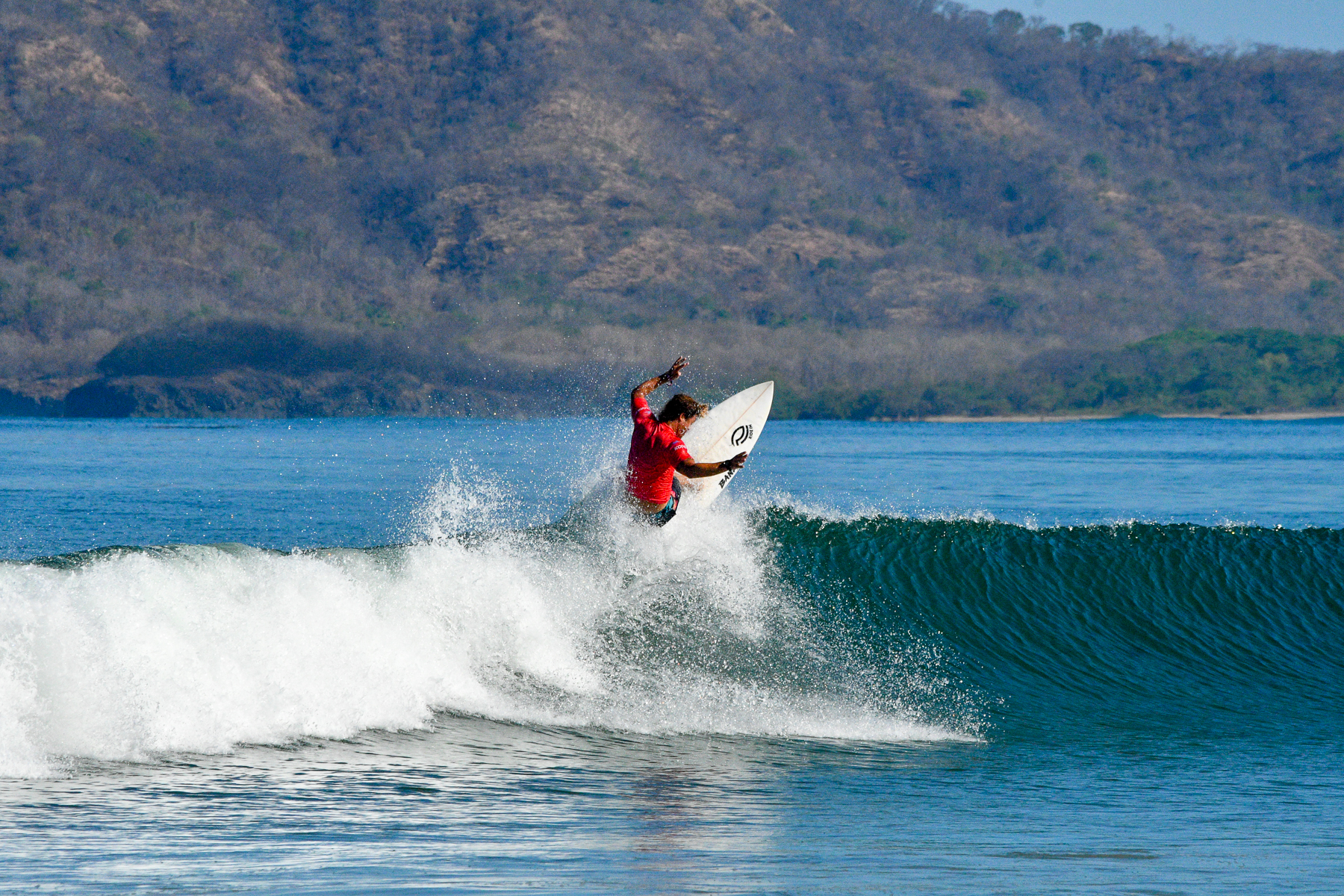 Surfing in Tamarindo Bay near Capitan Suizo