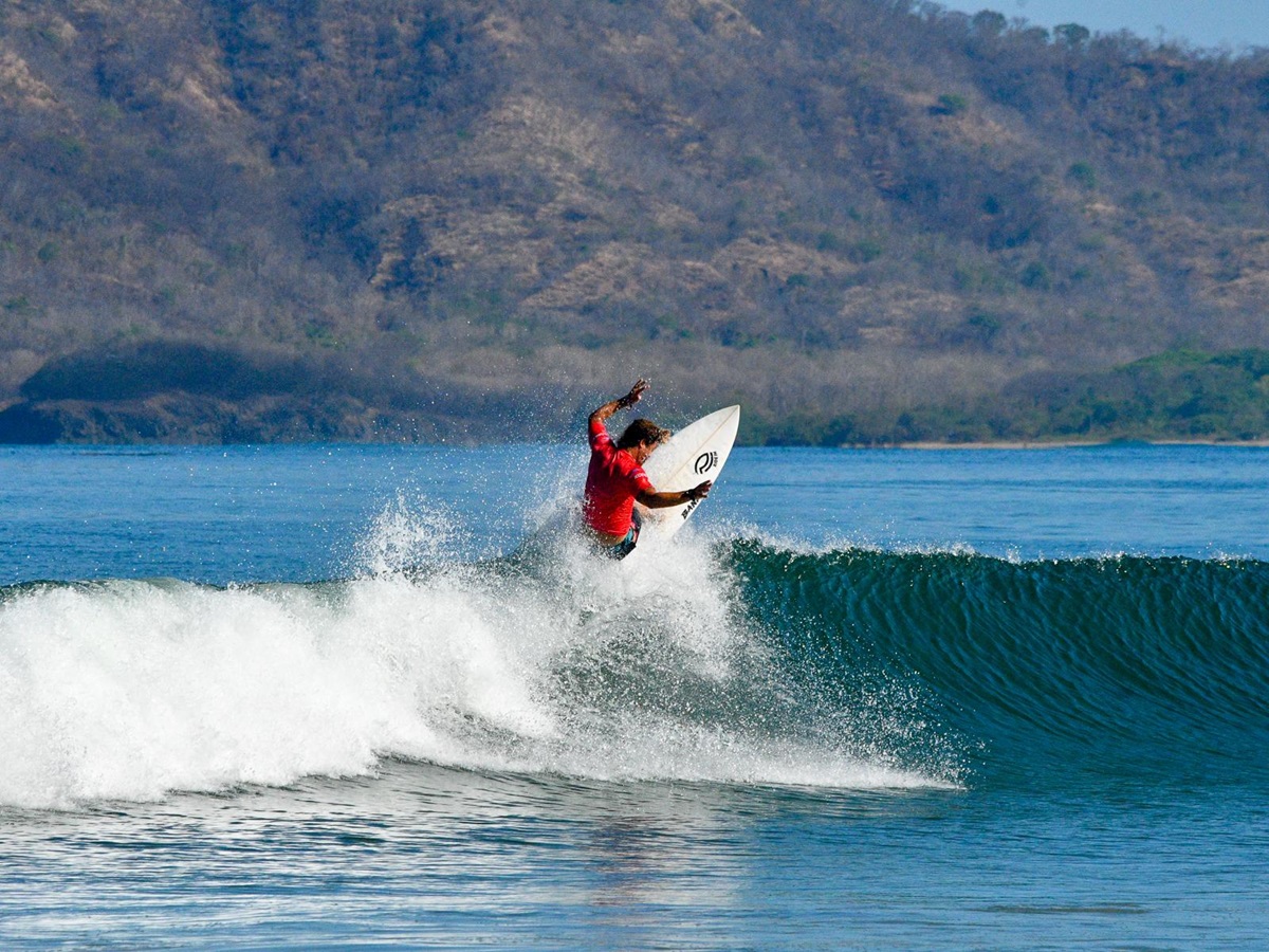 Surfing in Tamarindo Bay near Capitan Suizo