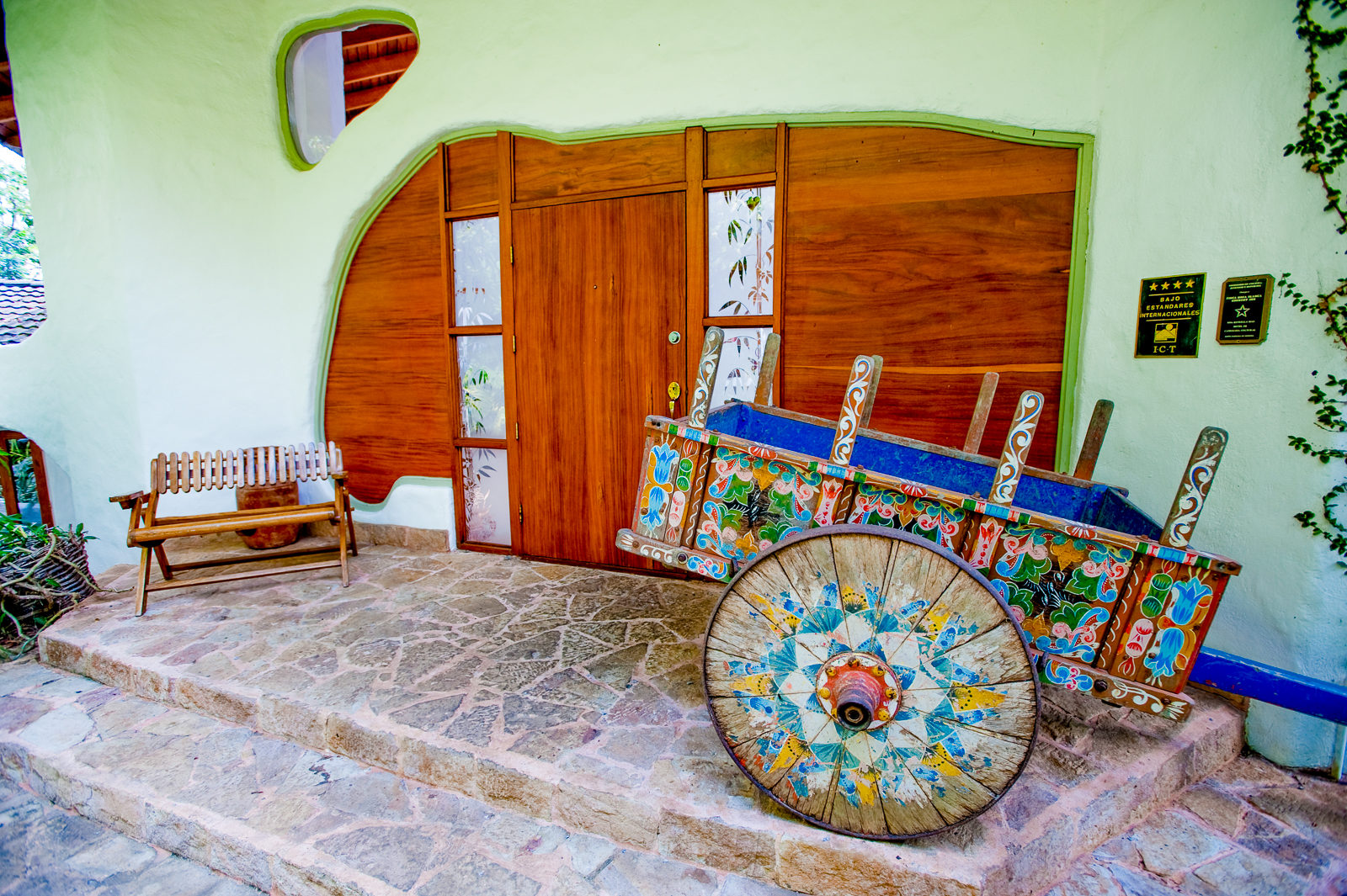 A colourful wagon outside a suite at Finca Rosa Blanca