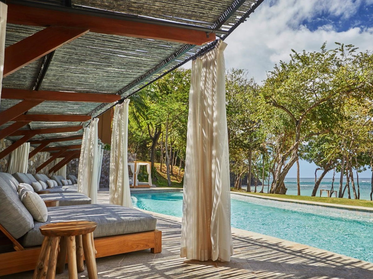 Loungers by the pool at Four Seasons Costa Rica on the Papagayo Peninsula