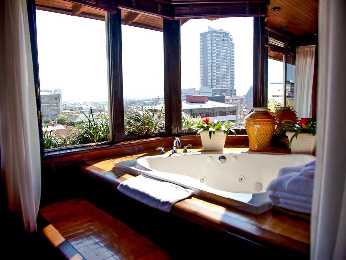 Vista de Oro suite bathroom overlooking the city at Hotel Grano de Oro in San Jose