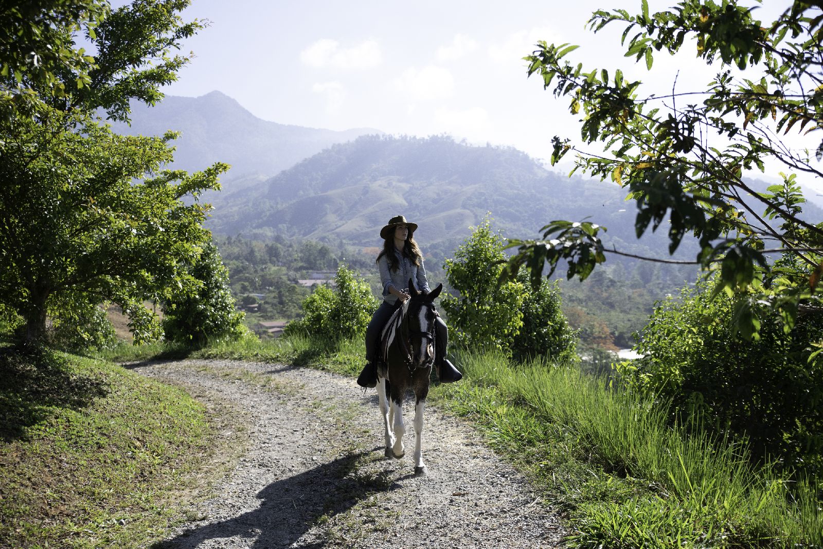Guest enjoying horse riding trails at Hacienda Alta Gracia Costa Rica