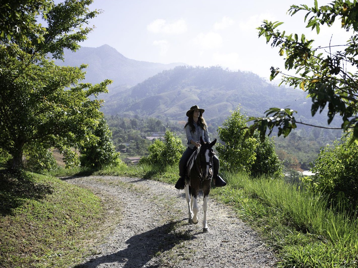 Guest enjoying horse riding trails at Hacienda Alta Gracia Costa Rica