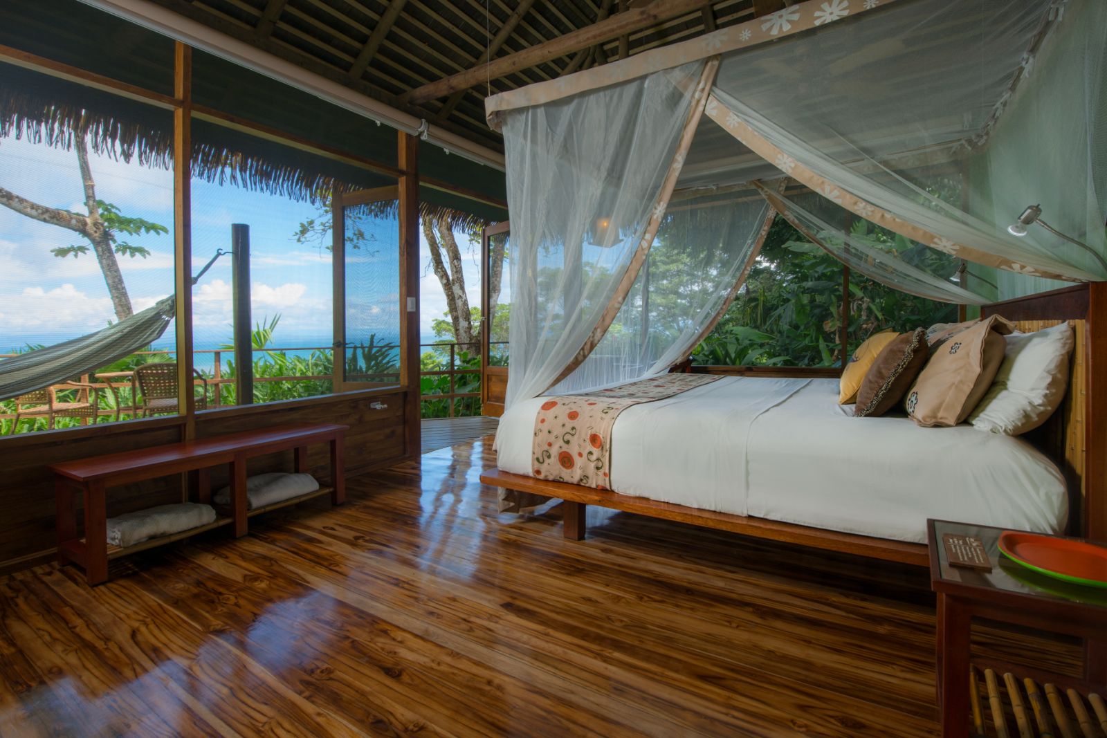 Guest suite bedroom at Lapa Rios resort in Costa Rica
