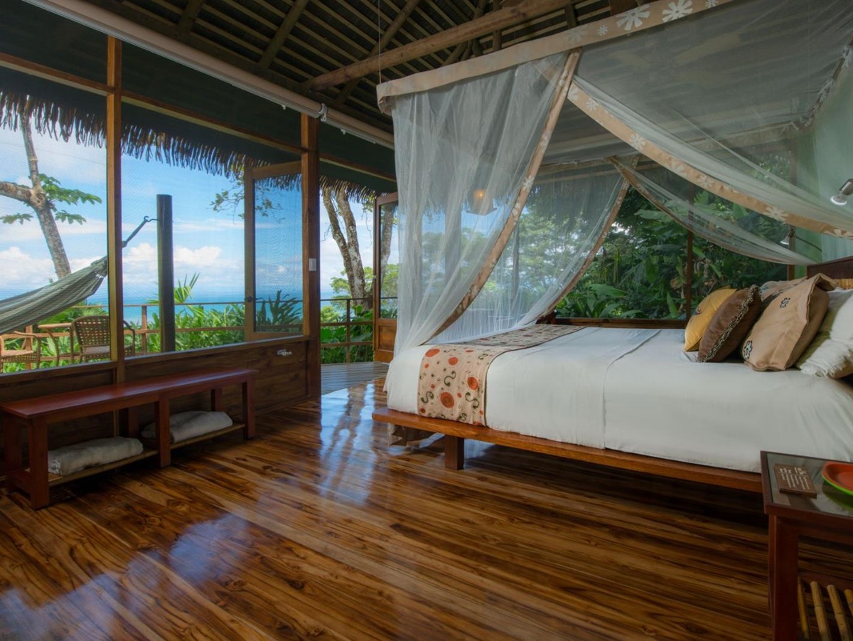 Guest suite bedroom at Lapa Rios resort in Costa Rica