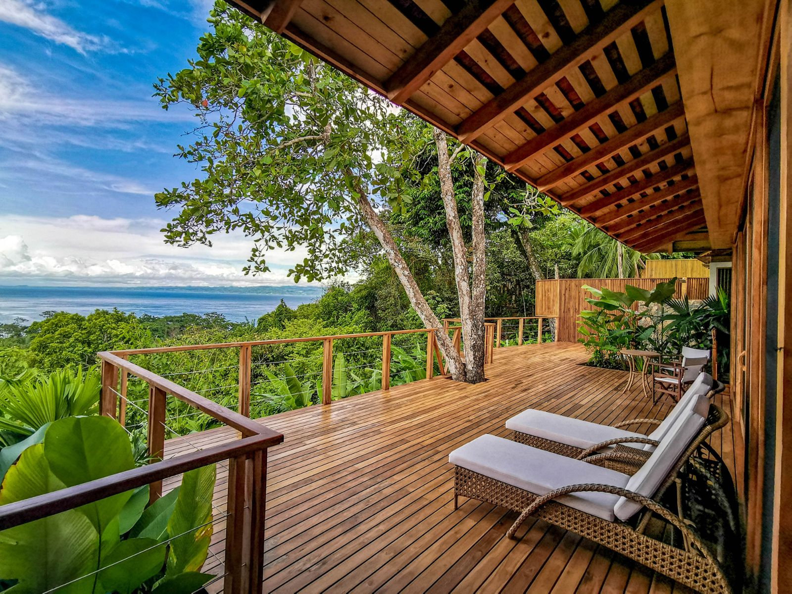 Villa terrace and sun loungers at Lapa Rios resort in Costa Rica