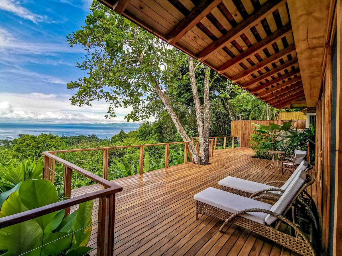 Villa terrace and sun loungers at Lapa Rios resort in Costa Rica