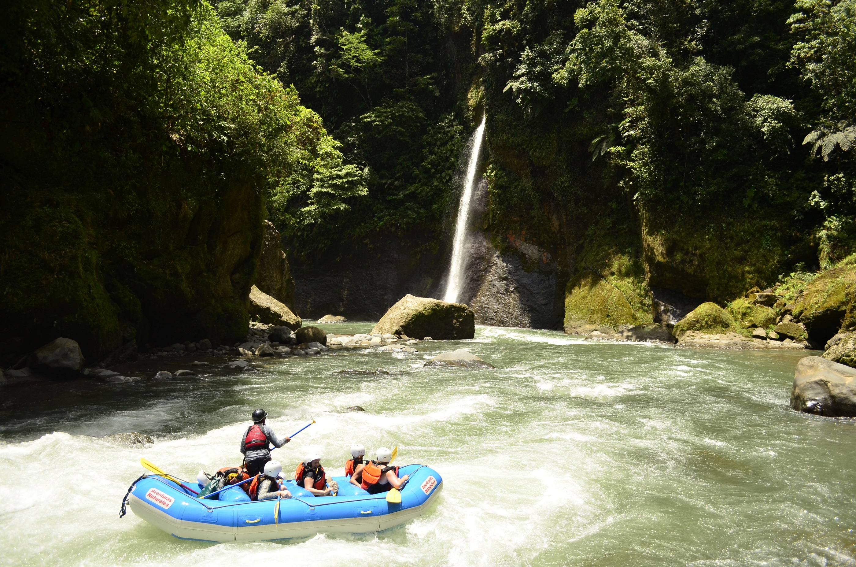 Wild water rafting with a waterfall in the background near Pacaure Lodge, Hotel Grano de Oro, Costa Rica
