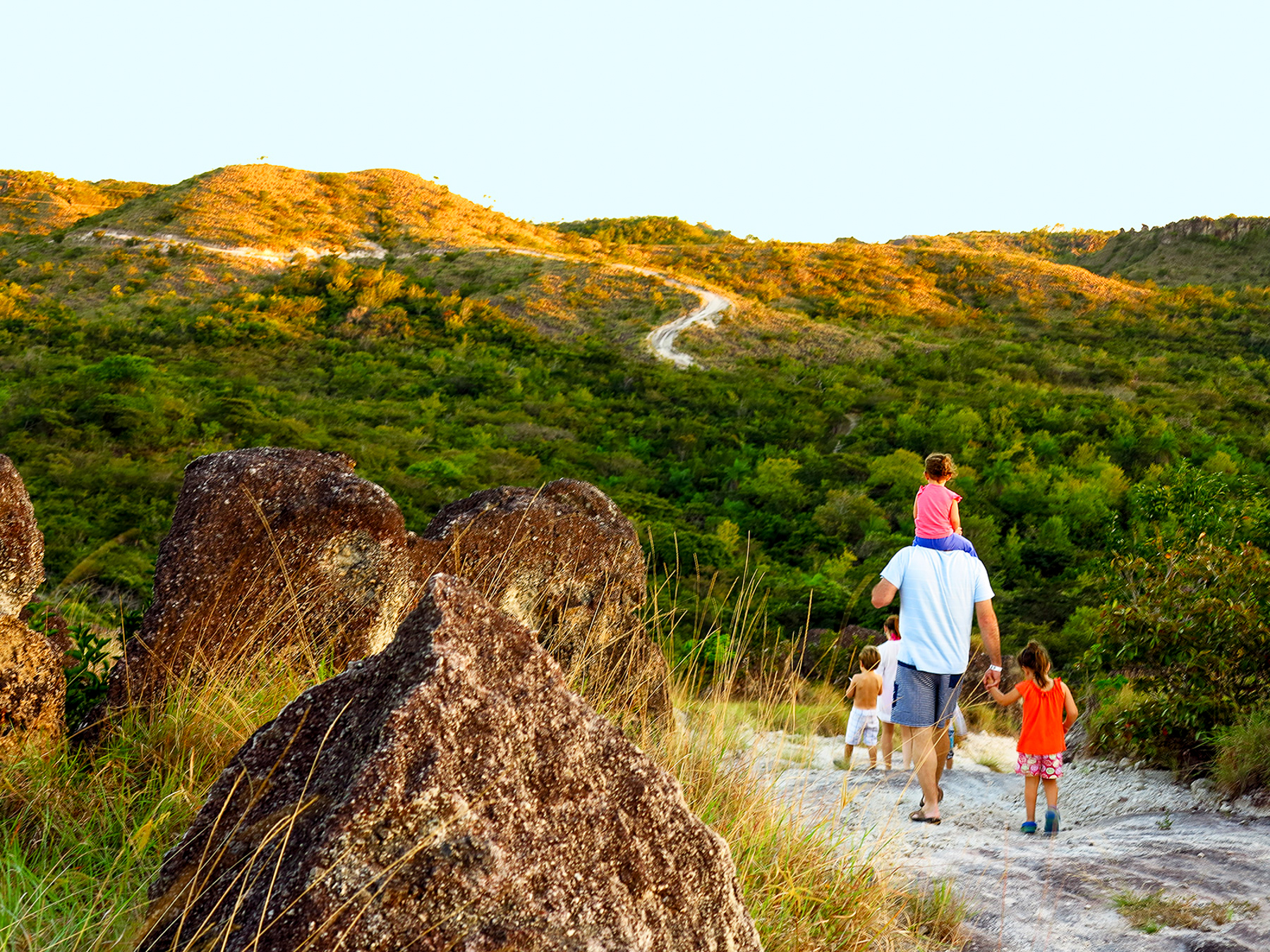 A family walking on the grounds of Rio {erdido in Costa Rica