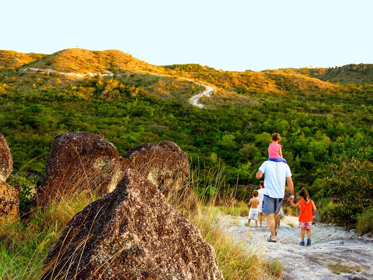 A family walking on the grounds of Rio {erdido in Costa Rica