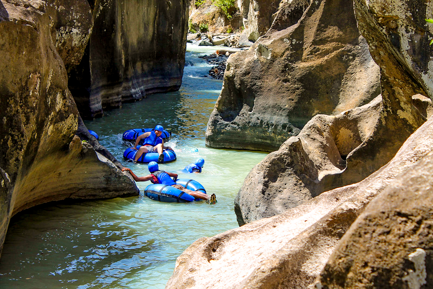 Tubing along the river canyon at Rio Perdido in Costa Rica