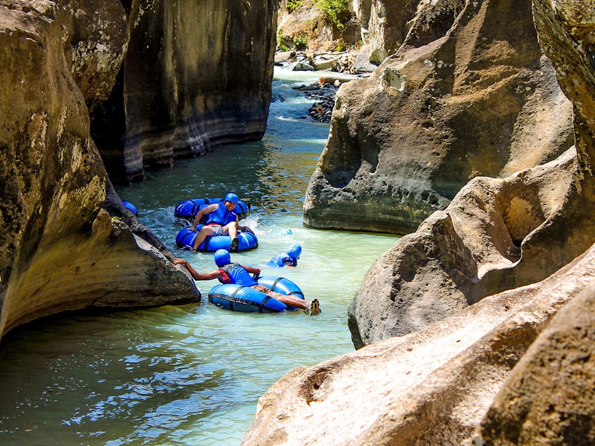 Tubing along the river canyon at Rio Perdido in Costa Rica
