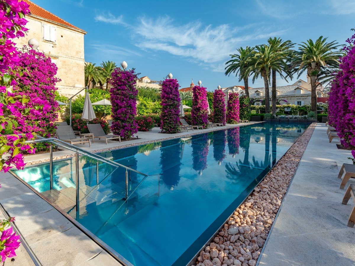 The swimming pool and terrace at Hotel Lemongarden on Brac island Croatia