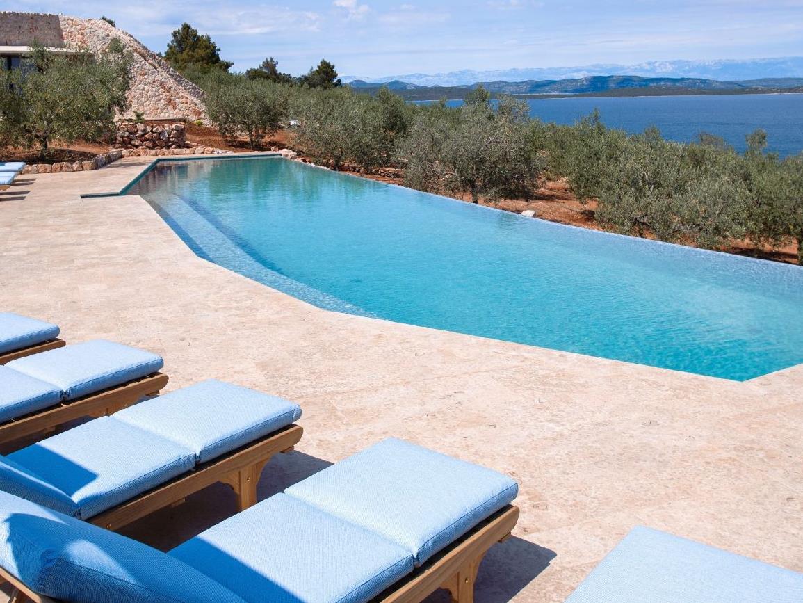 Pool and sun terrace at Villa Nai 3.3 in Croatia