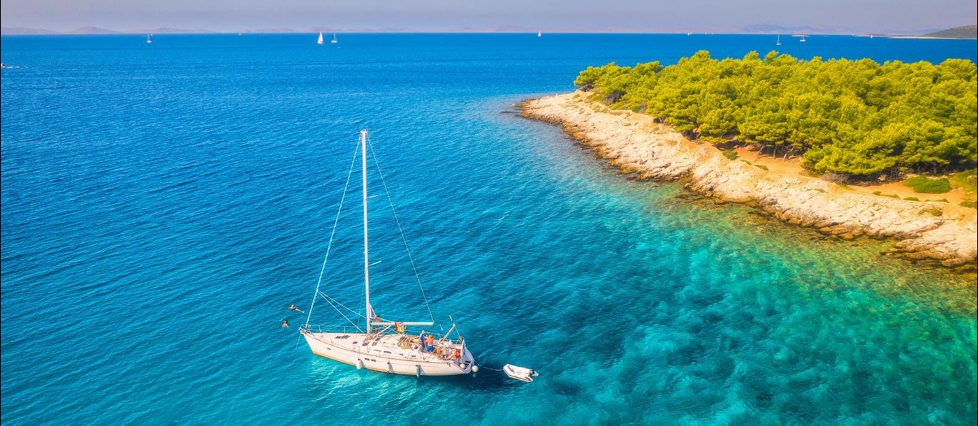 Aerial view of a gulet sailing in turquoise waters in Croatia