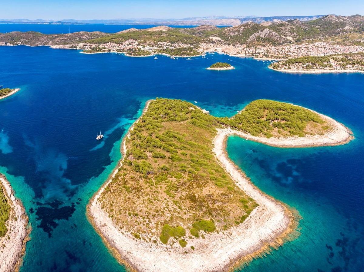 Aerial of group of islands with boats