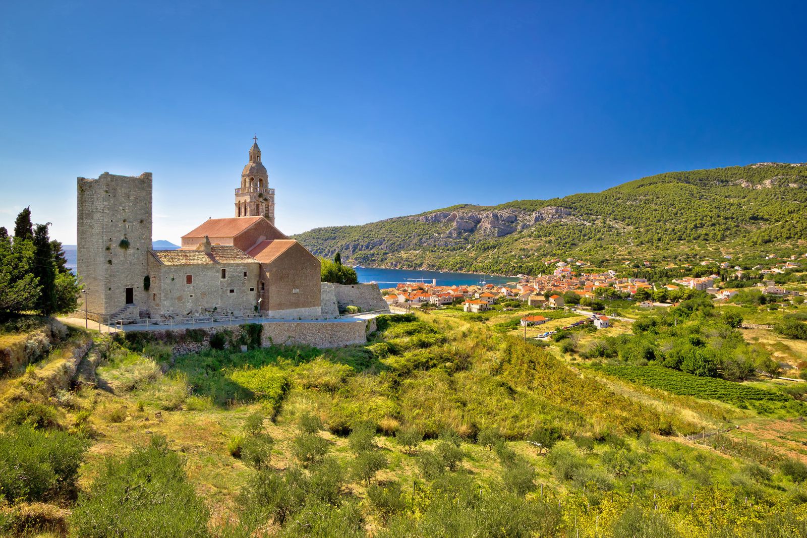 The historic town of Komiza and surrounding countryside in Vis, Croatia
