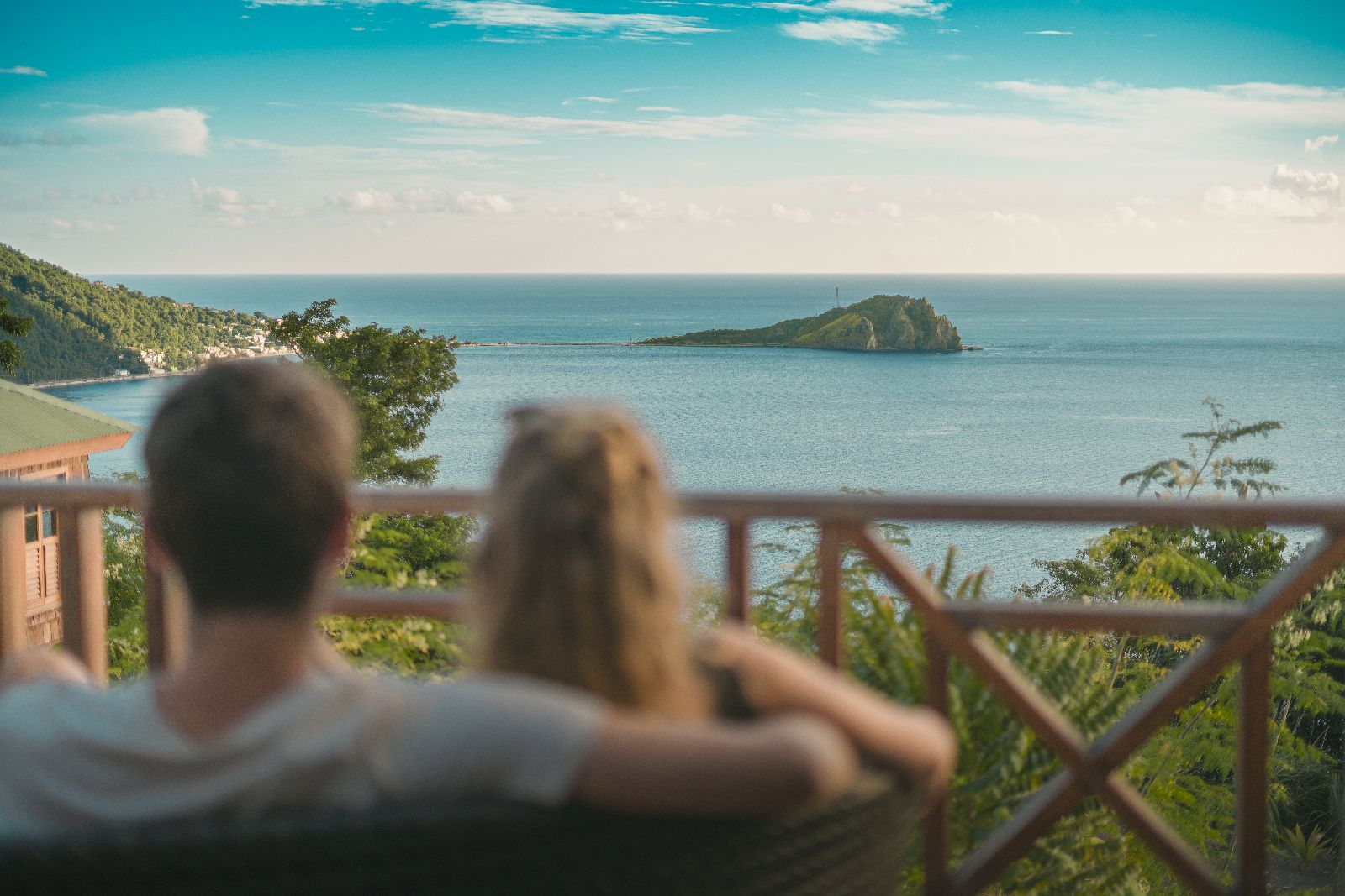Couple enjoying the sea views from their terrace at Jungle Bay Dominica