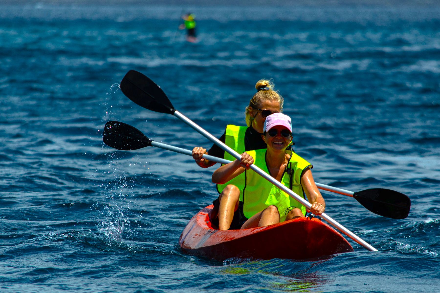 Guests of Hermes luxury catamaran kayaking in the Galapagos