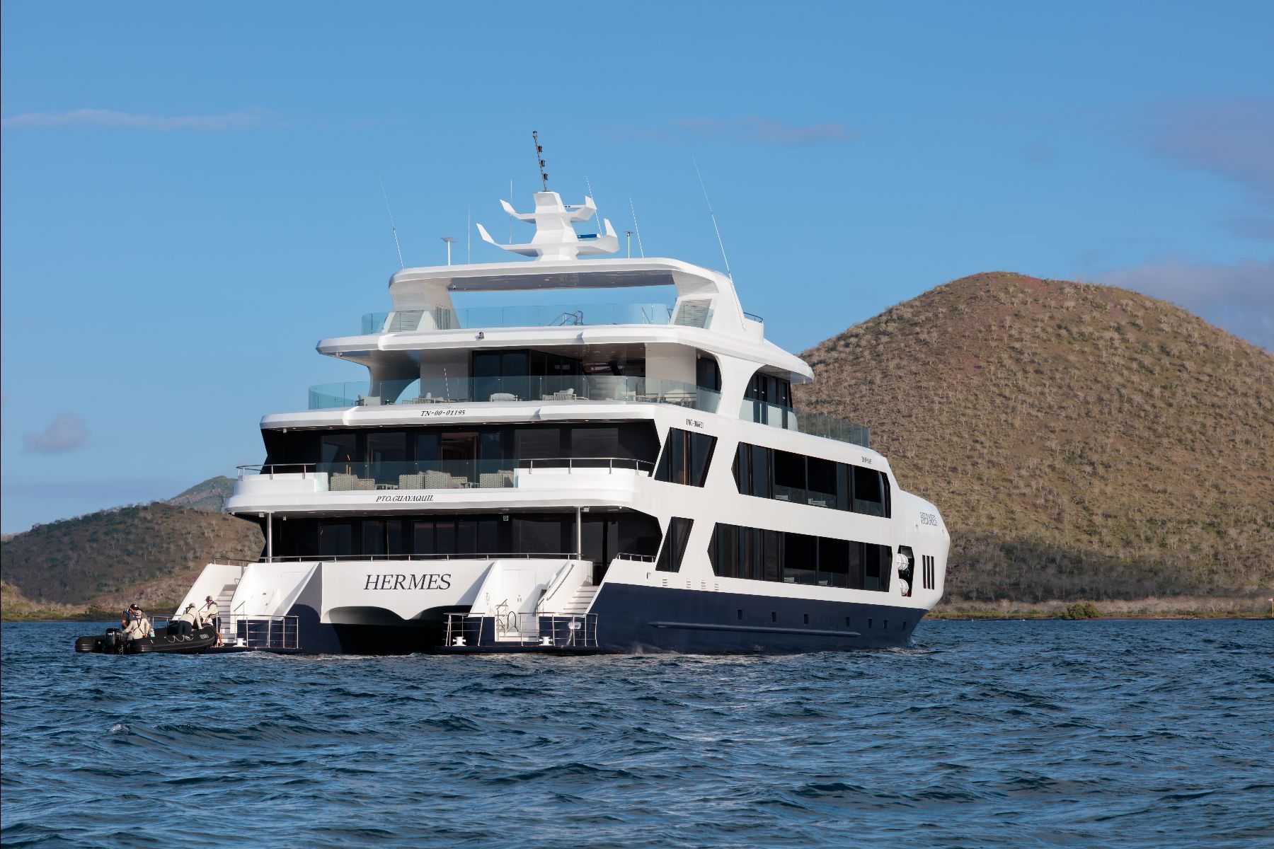 Exterior view of the Hermes Galapagos luxury catamaran anchored near a bay