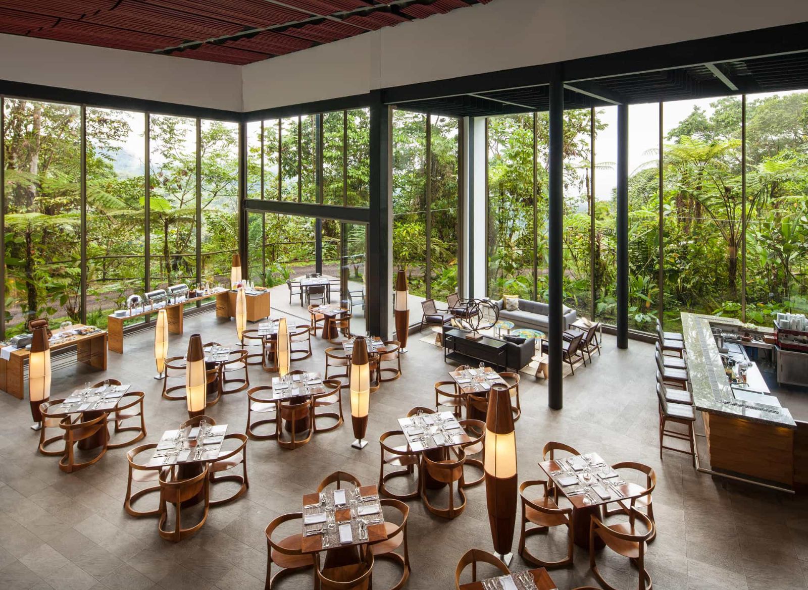 Bright and spacious restaurant at Mashpi Lodge with floor-to-ceiling windows, Ecuador