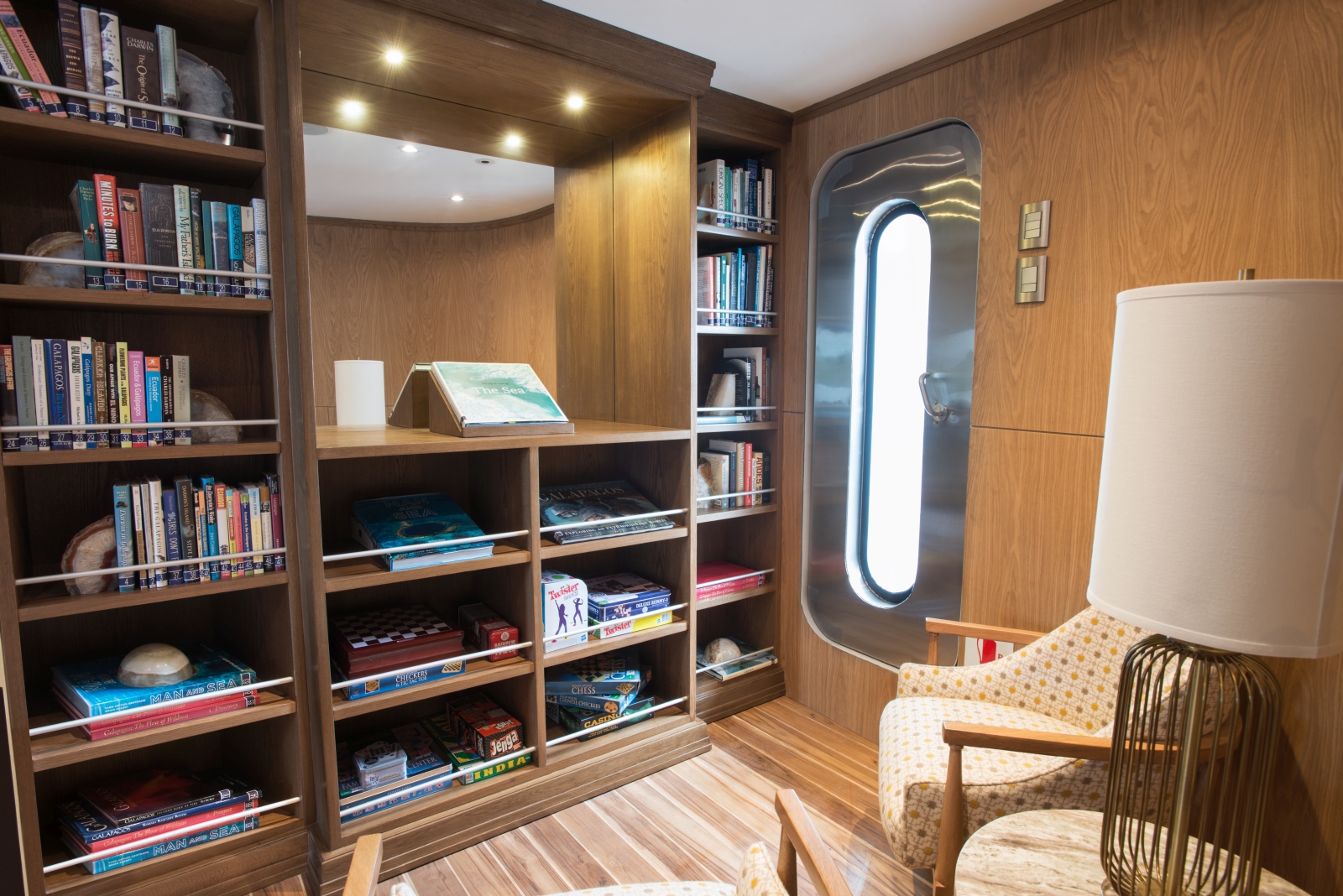 Library on board Origin in Galapagos