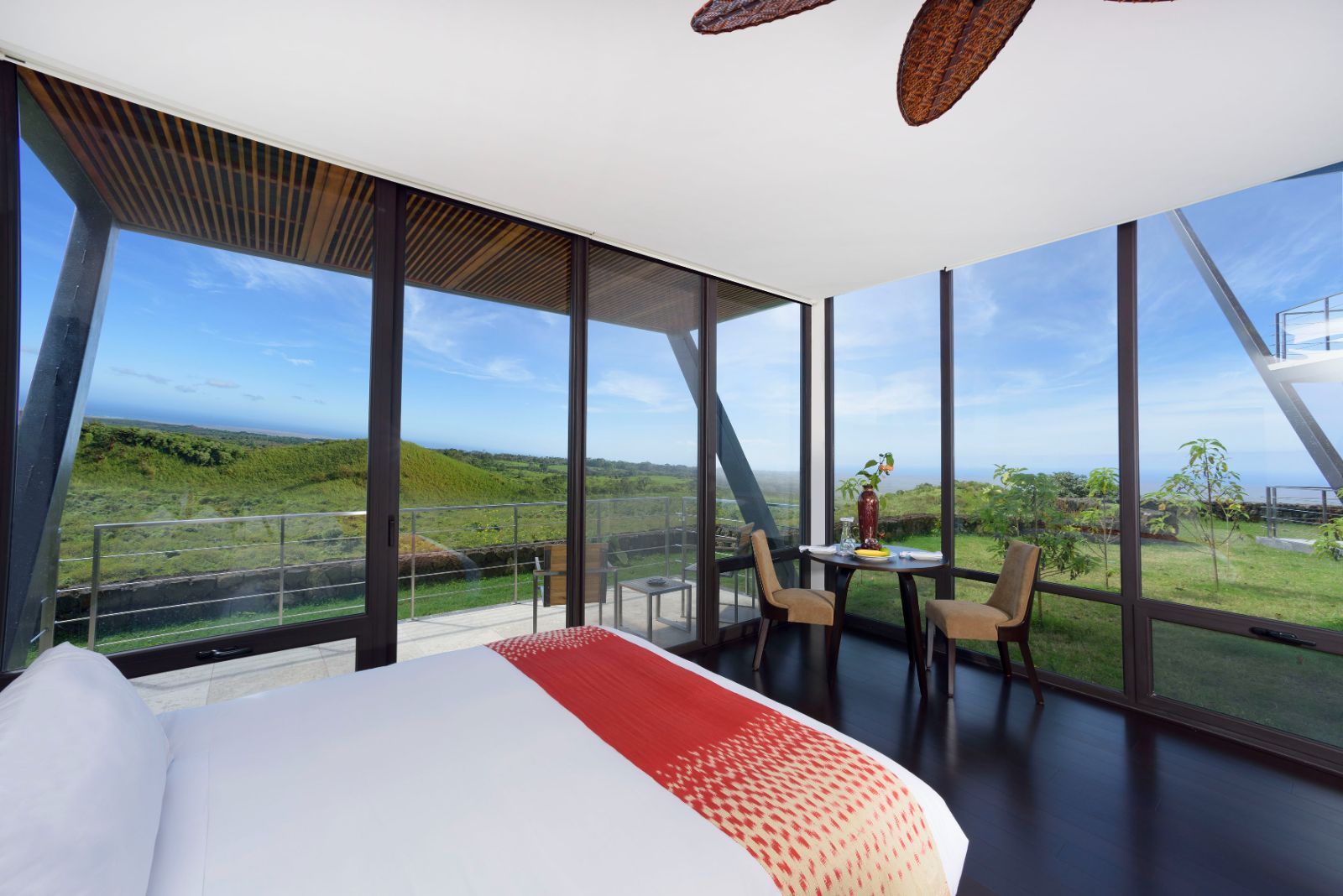 Terrace Room with floor-to-ceiling windows and private terrace at luxury lodge Pikaia Lodge in Ecuador