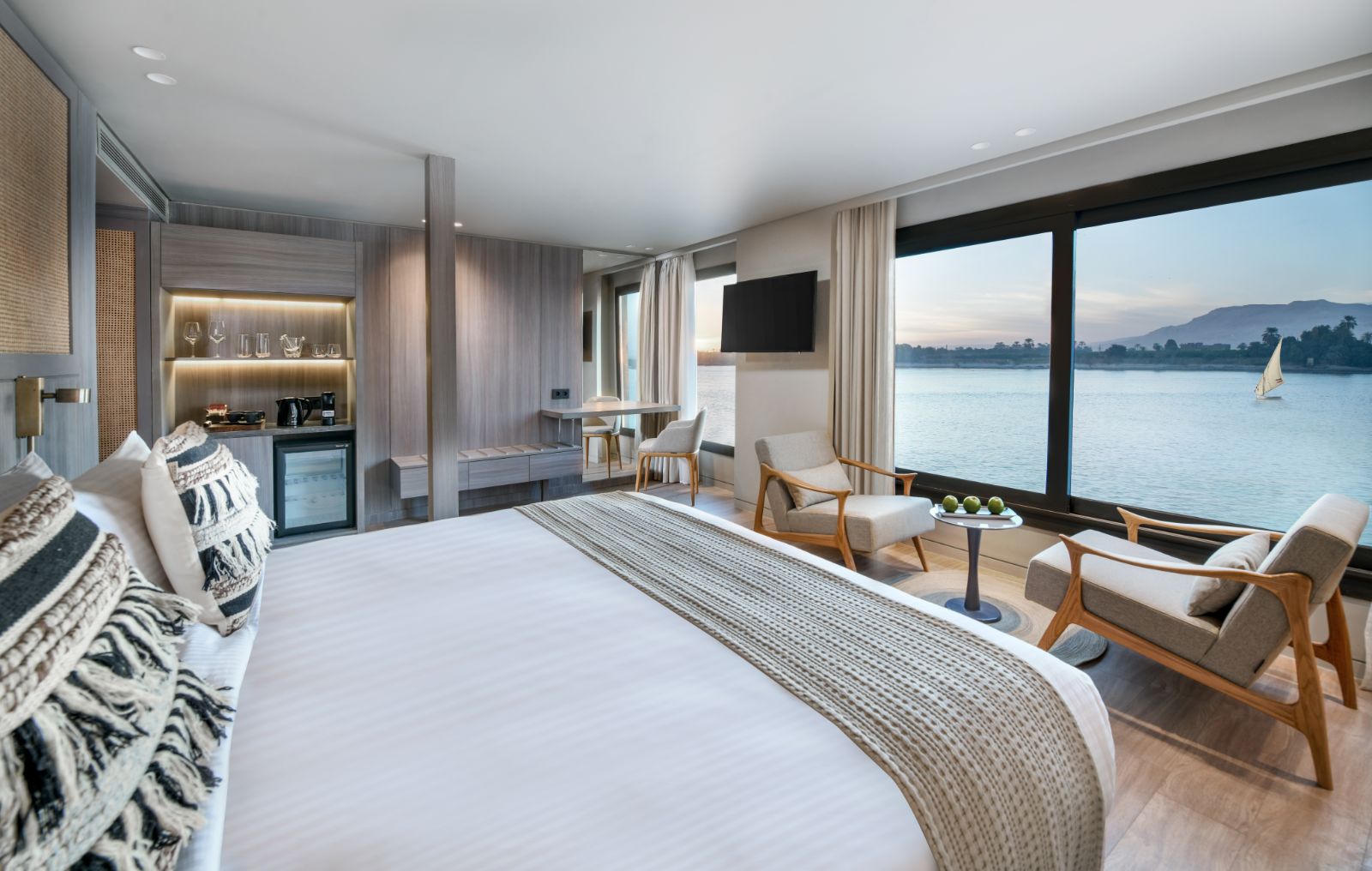 Guest bed and suite onboard the Historia boutique Nile cruise hotel in Egypt