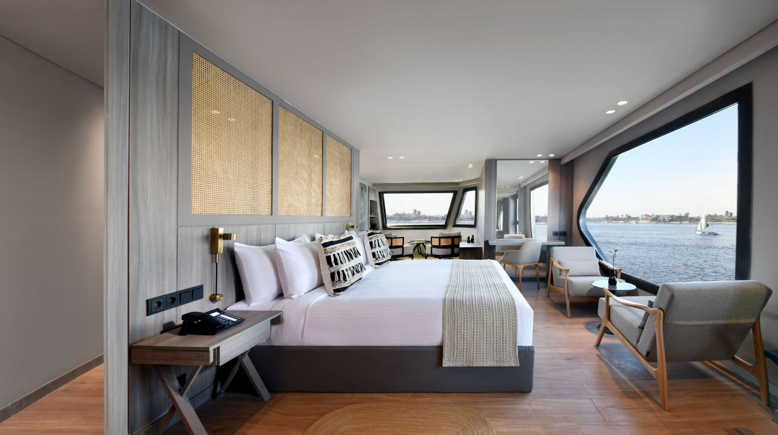 Guest suite bedroom with views onboard the Historia boutique Nile cruise hotel in Egypt